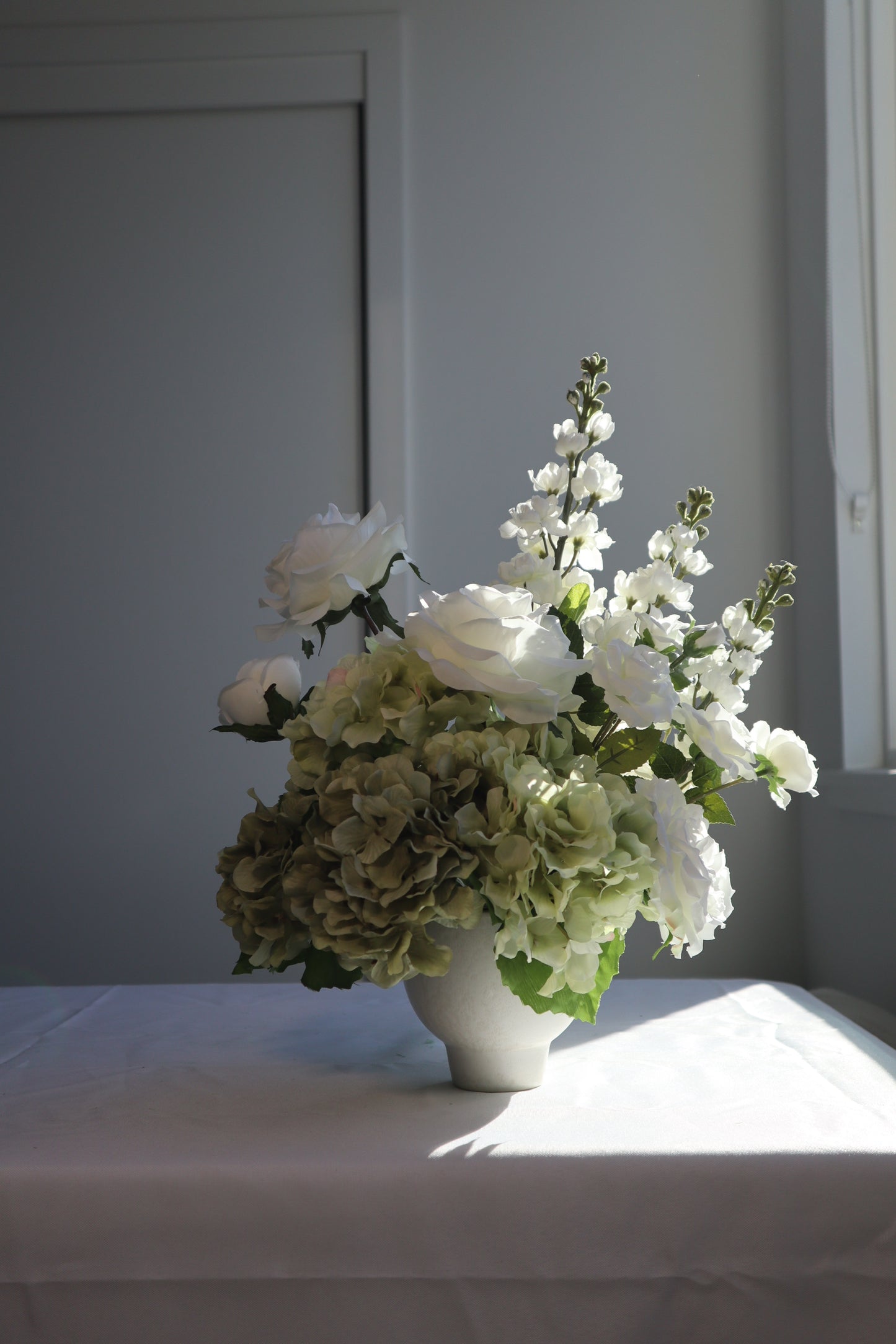 Hydrangea and White Rose Centerpiece Arrangement